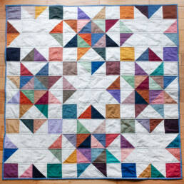 starry gems baby quilt in watercolor wovens