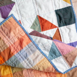 starry gems baby quilt in watercolor wovens